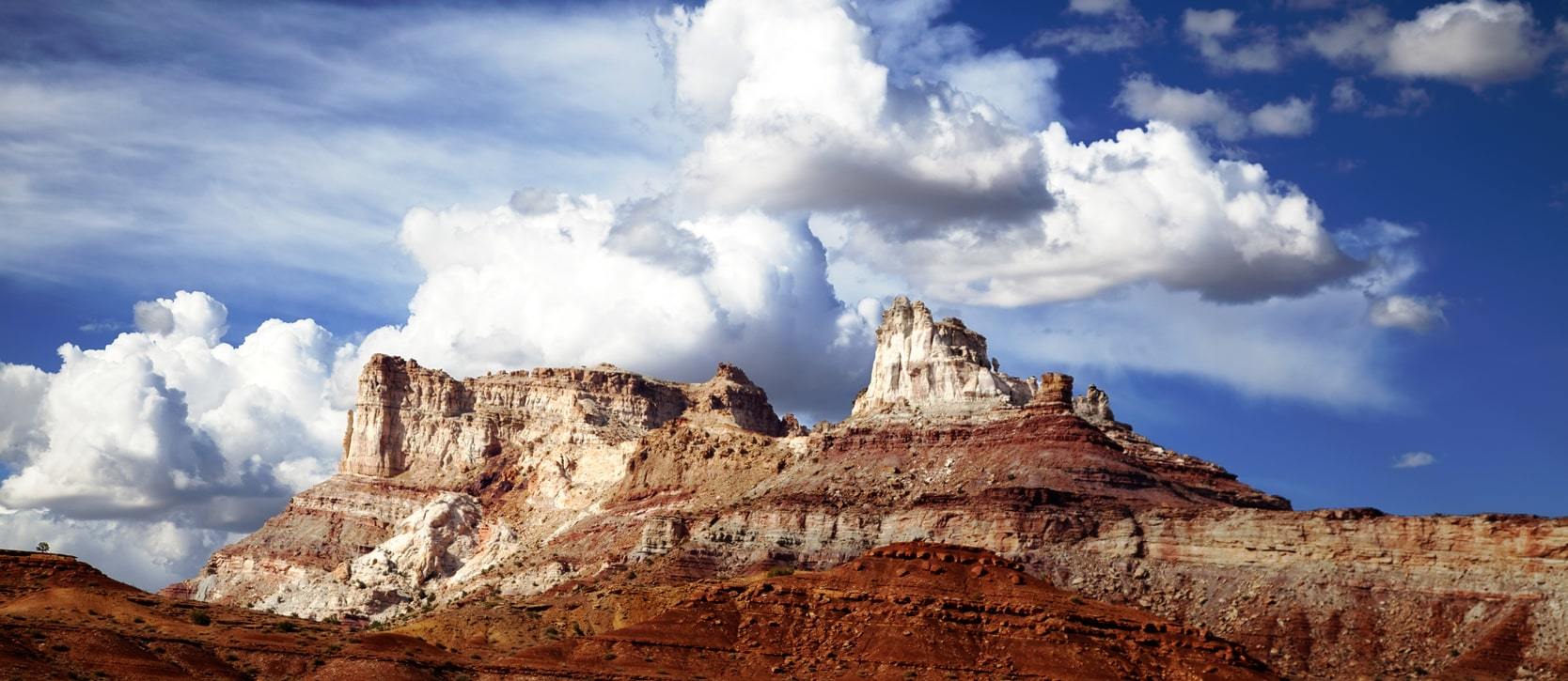 Stunning fluffy white cloud overtop mountain peaks near Elim Valley in Southern Utah