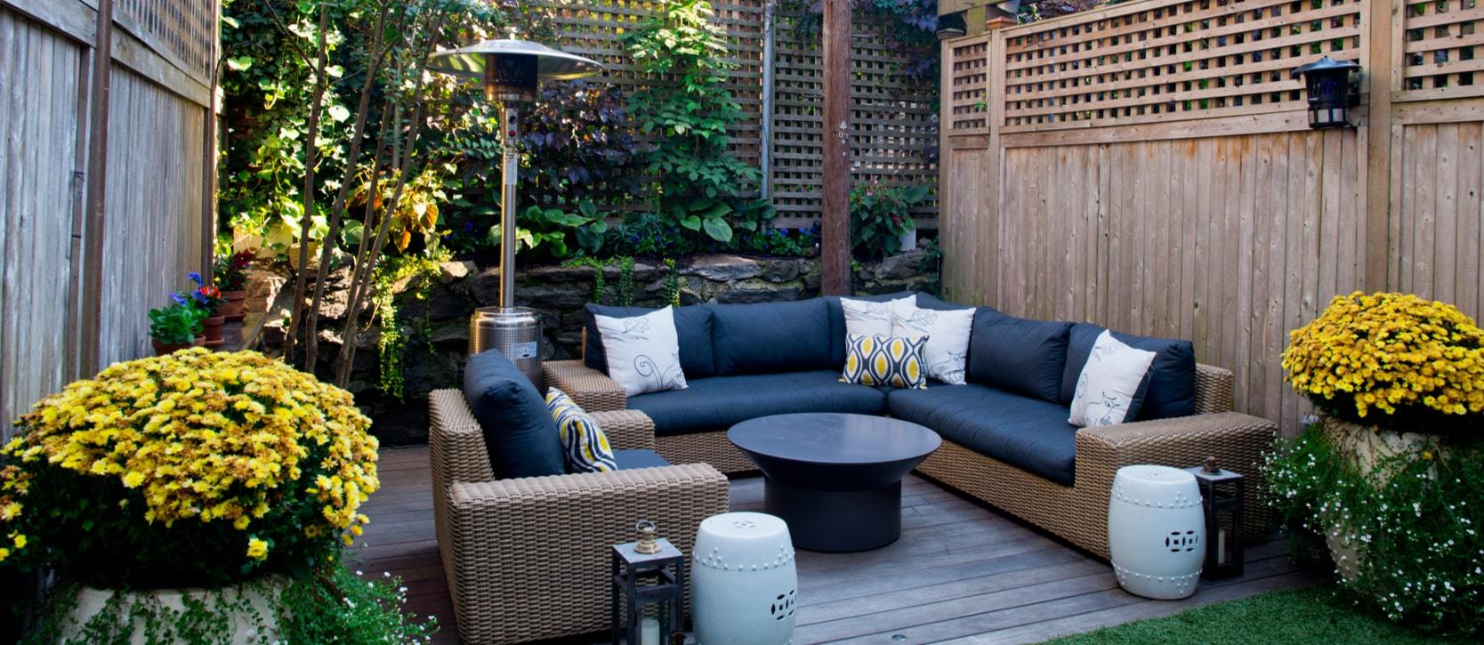 Beautiful backyard space with decor including couches and plants